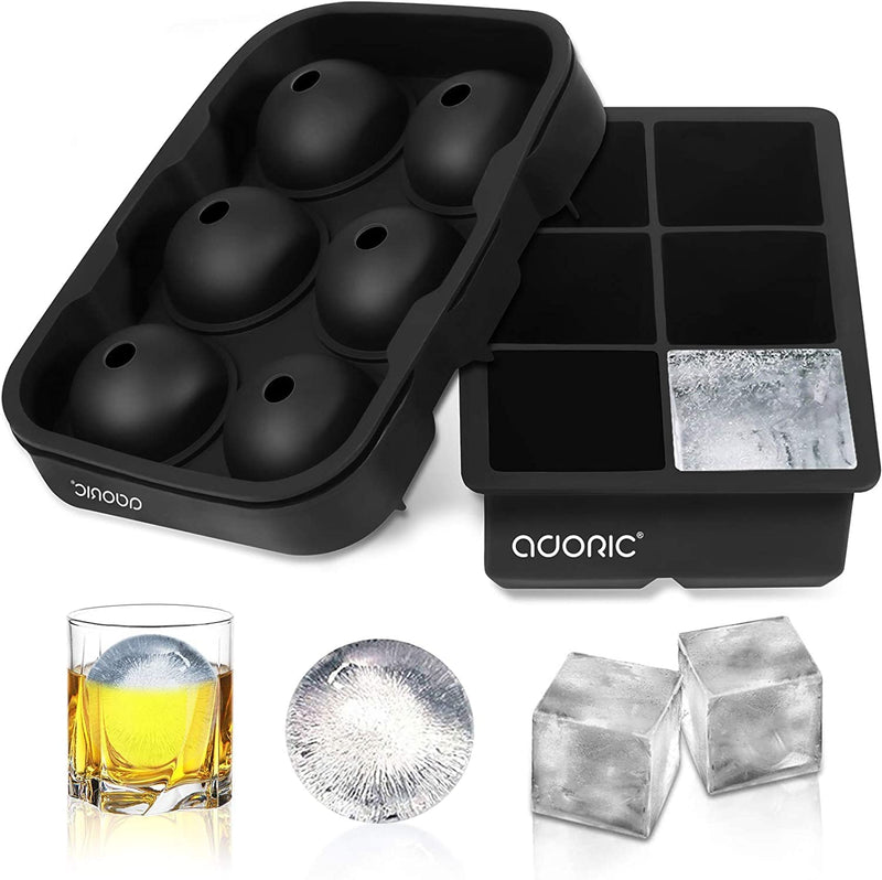 Silicone ice cube tray with molded ice cubes, a glass of whiskey, and ice cubes on a white background.