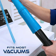 Blue and black vacuum attachment held by a person with text 'FITS MOST VACUUMS' in the foreground.
