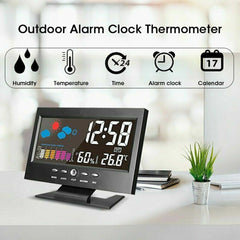 Outdoor alarm clock thermometer on a desk with a blurred background