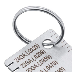 Metal keychain with gauge markings on a white background