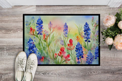 Floral painting on a wooden floor with shoes and flowers.
