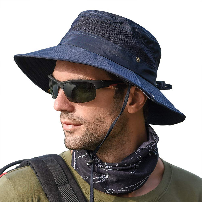 A man wearing a navy blue wide-brim sun hat with a chin strap, black sunglasses, and a dark patterned neck gaiter, shown in profile against a white background.