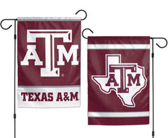 Two maroon and white Texas A&M garden flags displayed on black metal stands against a white background. One flag shows large white 'A&M' letters, and the other shows the Texas state outline with the same 'A&M' logo and 'TEXAS A&M' text.