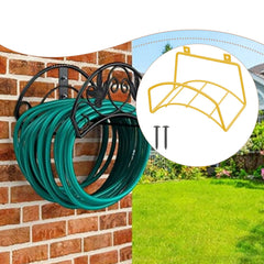 Black wrought-iron garden hose holder mounted on a brick wall, holding a coiled green hose. A circular inset shows the included yellow support bracket and mounting screws, with a blurred outdoor garden background.