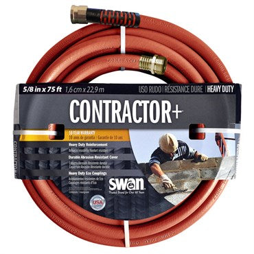 A coiled orange-red garden hose with brass connectors, wrapped around a black and white retail cardboard label that reads CONTRACTOR+ and shows the Swan brand.