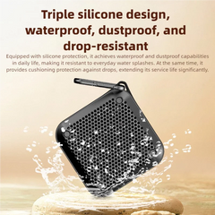 A black square portable speaker with a honeycomb grille floating above water droplets and wet stones, with promotional text about triple silicone design, waterproof, dustproof, and drop-resistant features.