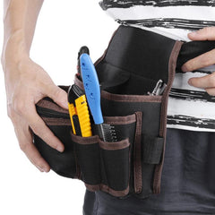 Person wearing a tool belt with various tools in it on a white background