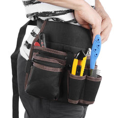 Person wearing a black tool belt with various tools on a white background