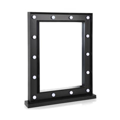 Black framed mirror with white bulbs on a white background