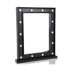 Black framed mirror with white bulbs on a white background
