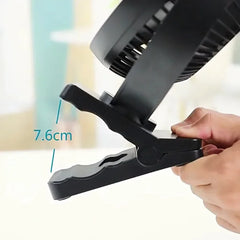 Black clip with a measurement label on a white background