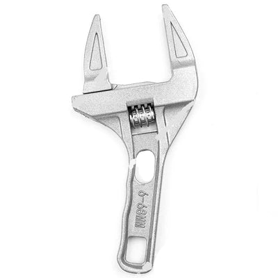 A silver metal adjustable wrench with a textured finish, featuring a spring-loaded jaw and a handle with a hanging loop, shown on a white background.
