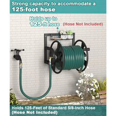 A wall-mounted garden hose reel with a green coiled hose, shown against a white brick wall with text overlays stating it holds up to 125-foot hose (hose not included). The reel is black with a green hose and small planters on the top shelf.