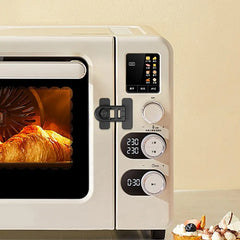 Small oven with digital controls and a pastry inside, on a light background