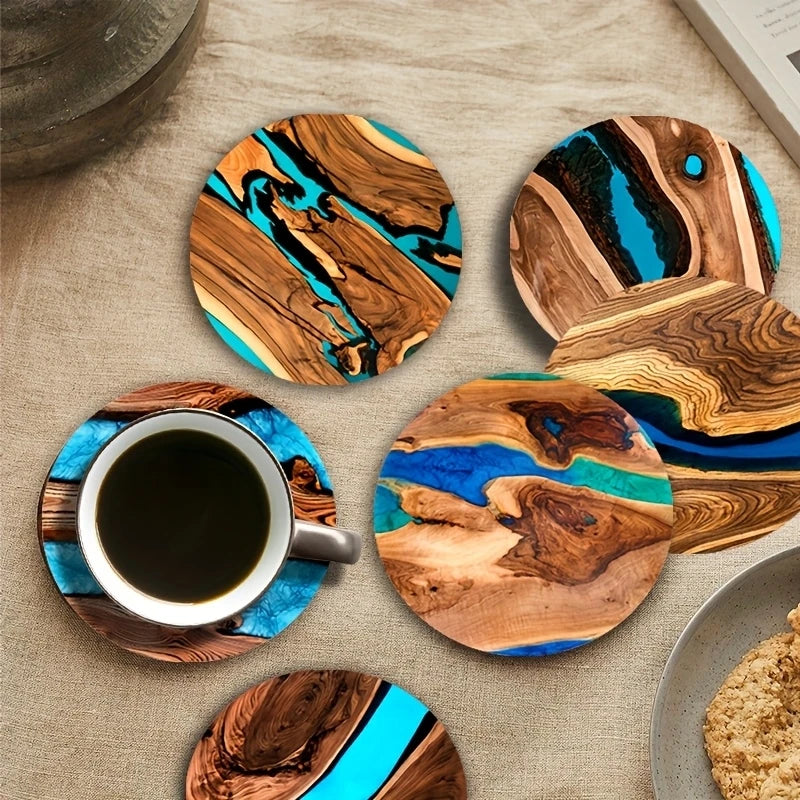 Wooden coasters with blue resin on a table with a cup of coffee.