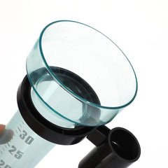 A close-up of a clear glass measuring cup with a black plastic collar and spout, shown against a white background.
