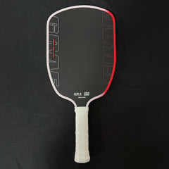 Pickleball paddle with black face, red border, and white handle on a black background