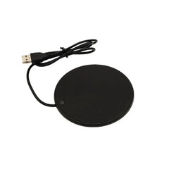 Black wireless charging pad with USB cable on a white background