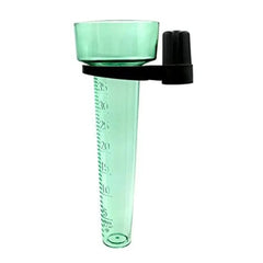 Green measuring cup with black handle on a white background