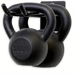 Pair of black cast iron kettlebells with '20 LB' marking on a white background