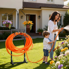 Woman and child using a garden hose with a stand in front of a house