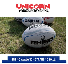 Three white rugby training balls with black and blue branding, including the prominent 'RHINO AVALANCHE' text and rhino logo, displayed on a grassy field. The image includes a top banner with the red 'UNICORN' logo and a bottom blue banner reading 'RHINO AVALANCHE TRAINING BALL'.