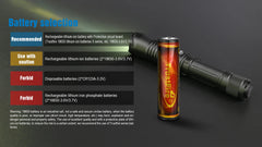 Flashlight with battery compatibility chart on a dark background