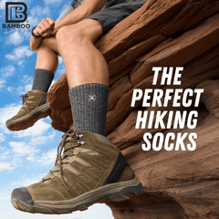 Person wearing hiking boots and socks with 'PB Bamboo Sports' branding, sitting on a rock with text 'The Perfect Hiking Socks'.