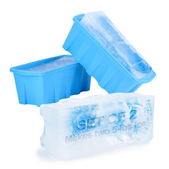 Two blue silicone ice cube trays shown with ice cubes inside, one closed and one open, on a white background. The front tray has embossed text reading 'SET OF 2 Makes two 5-lbs ice'.