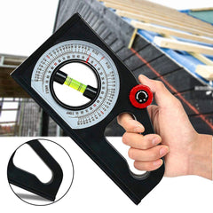 Hand holding a black angle finder with a detailed scale, set against a blurred construction background.