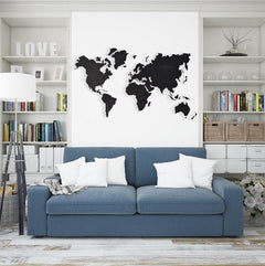 Living room with a blue sofa, world map on the wall, and bookshelves.