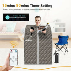 Person using a steam sauna blanket with remote control and timer display, featuring the brand 'Giantex'.