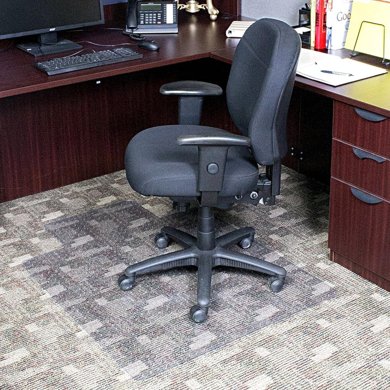 Gray office chair in front of a wooden desk with office supplies.