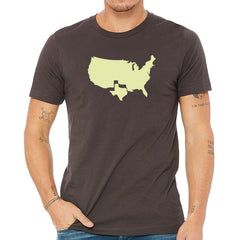 Man wearing a dark brown t-shirt with a light green outline of the United States on a white background