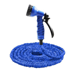 Blue expandable garden hose with spray nozzle on a white background