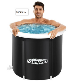 Man relaxing in a black inflatable bathtub with Xumano branding, on a white background.