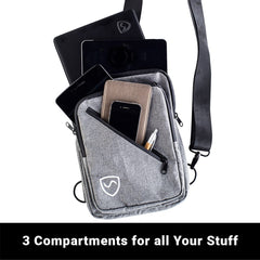 Gray crossbody bag with multiple compartments holding electronic devices and a pen on a white background.